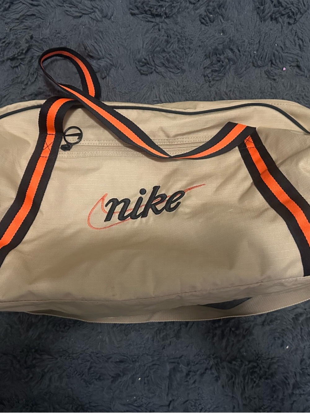 Nike Beige Duffel with Orange and Black Striped Handles